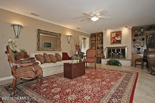 322 Pablo Road Ponte Vedra Beach, FL 32082 - Photo 9 of 19 a living room with furniture and a fireplace