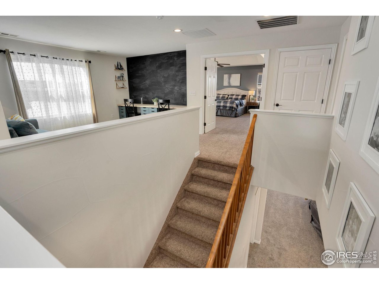 1540 Millfleet Drive Windsor, CO 80550 - Photo 19 of 40 a view of a living room with furniture and a flat screen tv