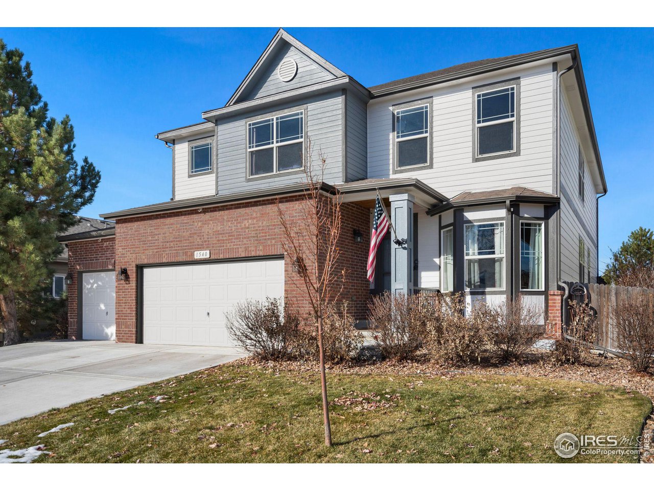1540 Millfleet Drive Windsor, CO 80550 - Photo 2 of 40 a front view of a house with a yard