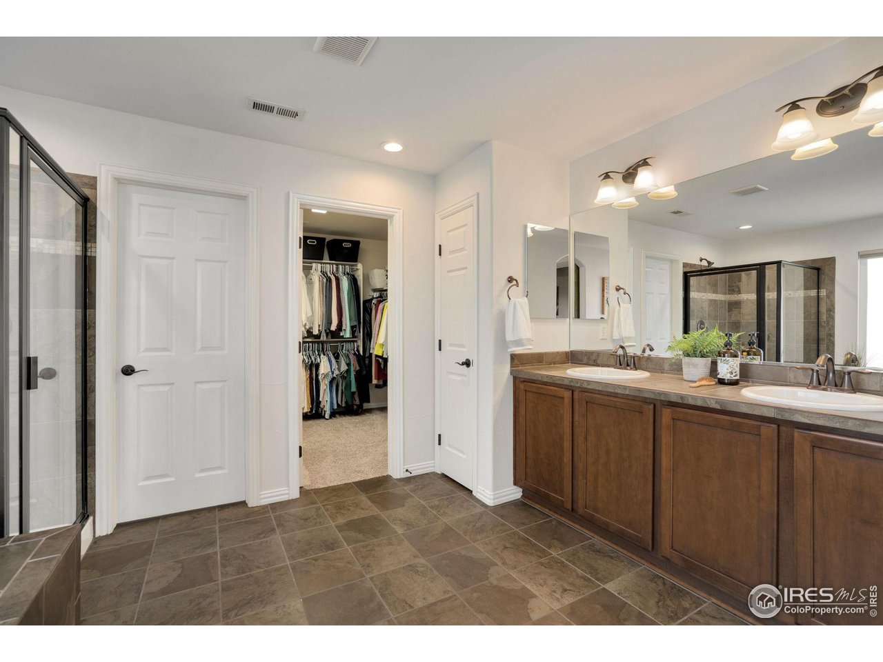 1540 Millfleet Drive Windsor, CO 80550 - Photo 22 of 40 a kitchen with cabinets and window