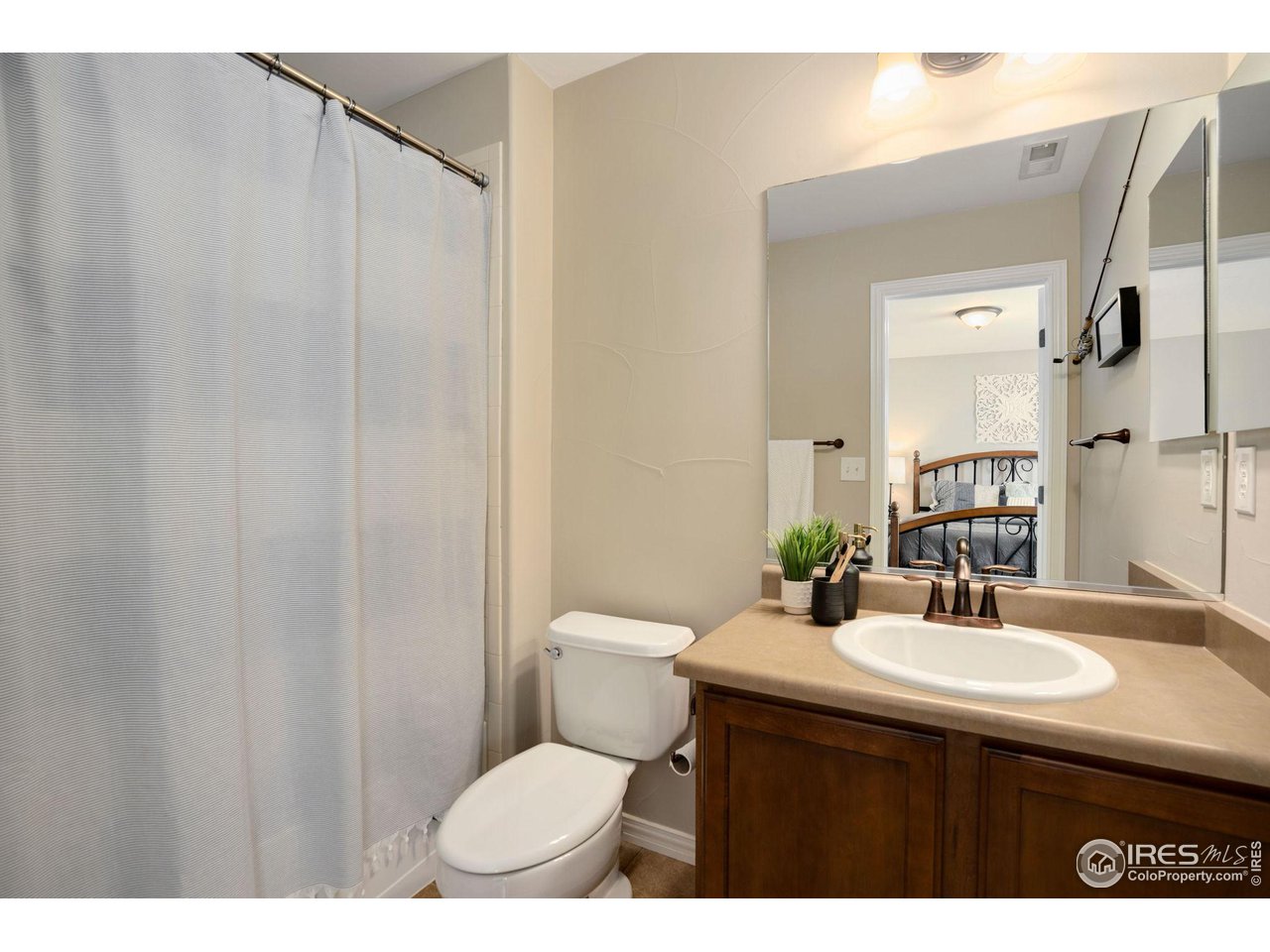 1540 Millfleet Drive Windsor, CO 80550 - Photo 26 of 40 a bathroom with a sink toilet and shower
