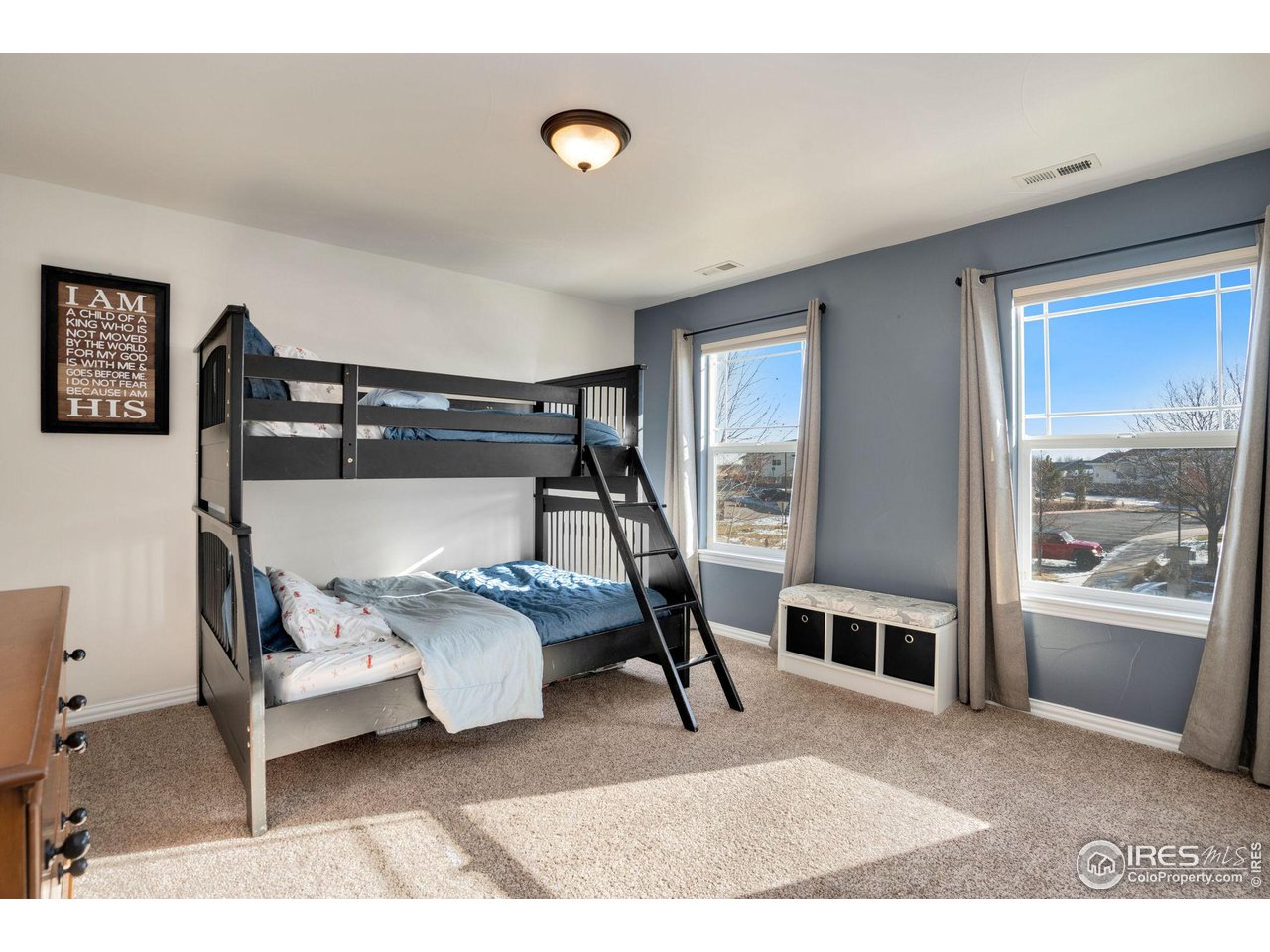 1540 Millfleet Drive Windsor, CO 80550 - Photo 30 of 40 a bedroom with a bed and large windows