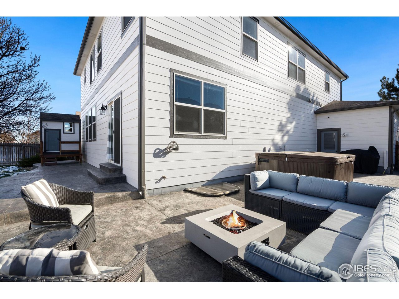 1540 Millfleet Drive Windsor, CO 80550 - Photo 36 of 40 a view of a patio with couches and a table and chairs with potted plants