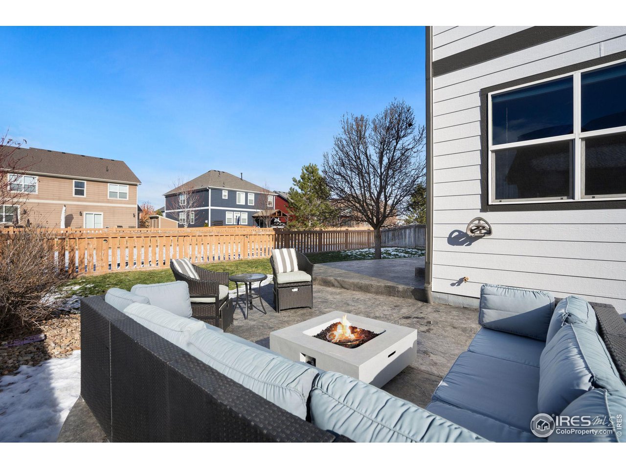 1540 Millfleet Drive Windsor, CO 80550 - Photo 37 of 40 a view of a patio with table and chairs with wooden floor and fence