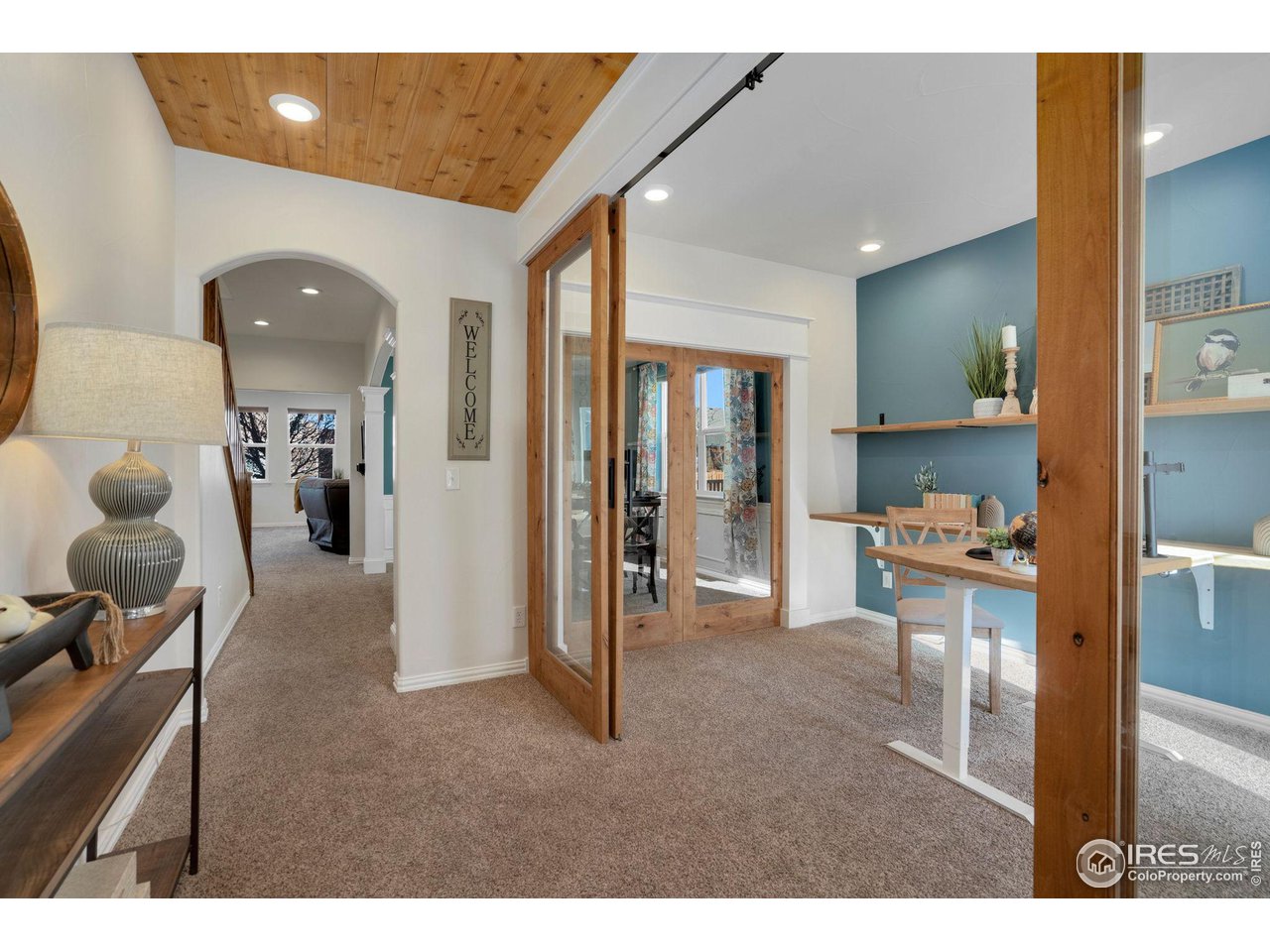 1540 Millfleet Drive Windsor, CO 80550 - Photo 4 of 40 a living room with furniture and a large window