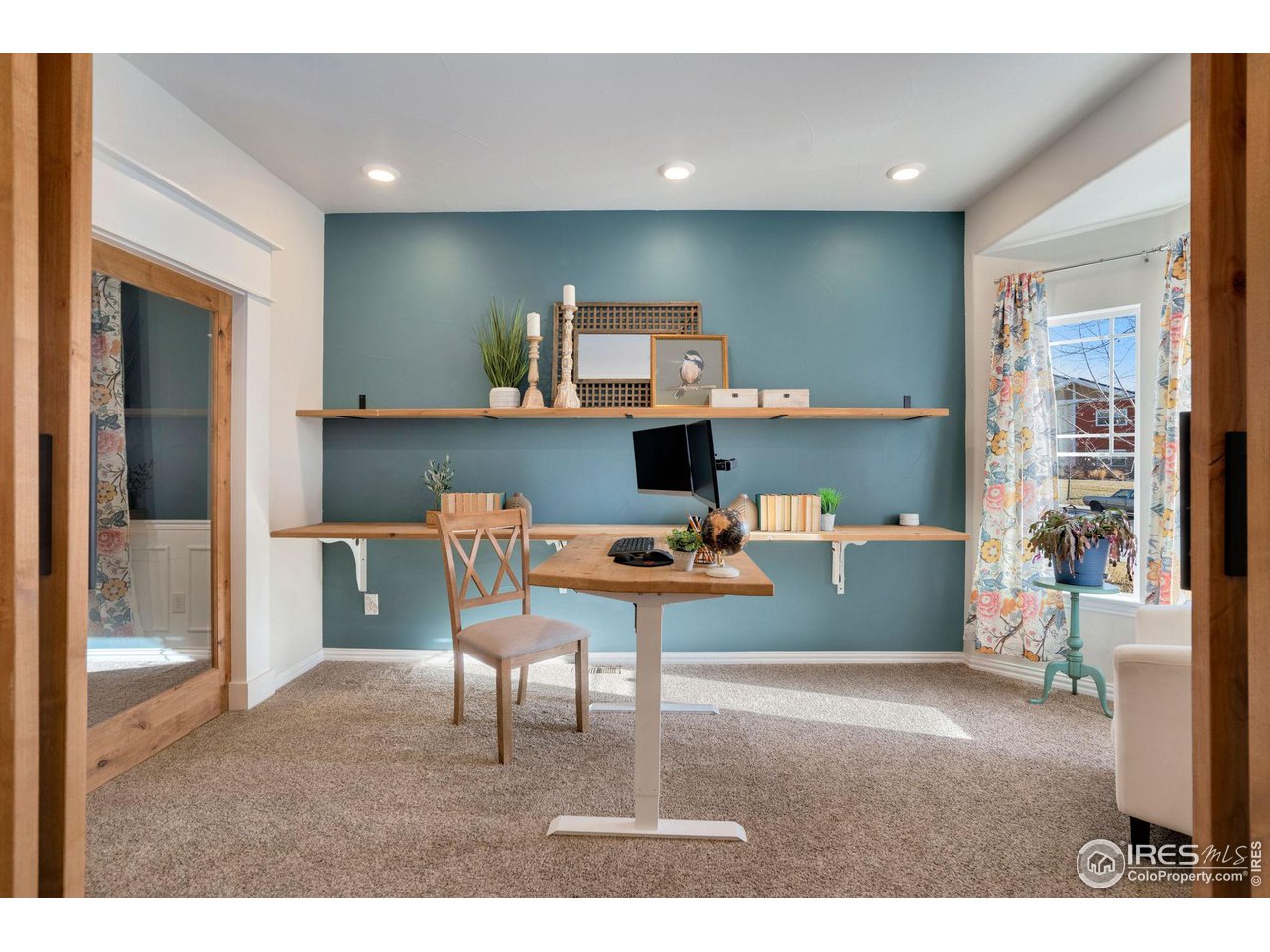 1540 Millfleet Drive Windsor, CO 80550 - Photo 5 of 40 a living room with a couch and a coffee table
