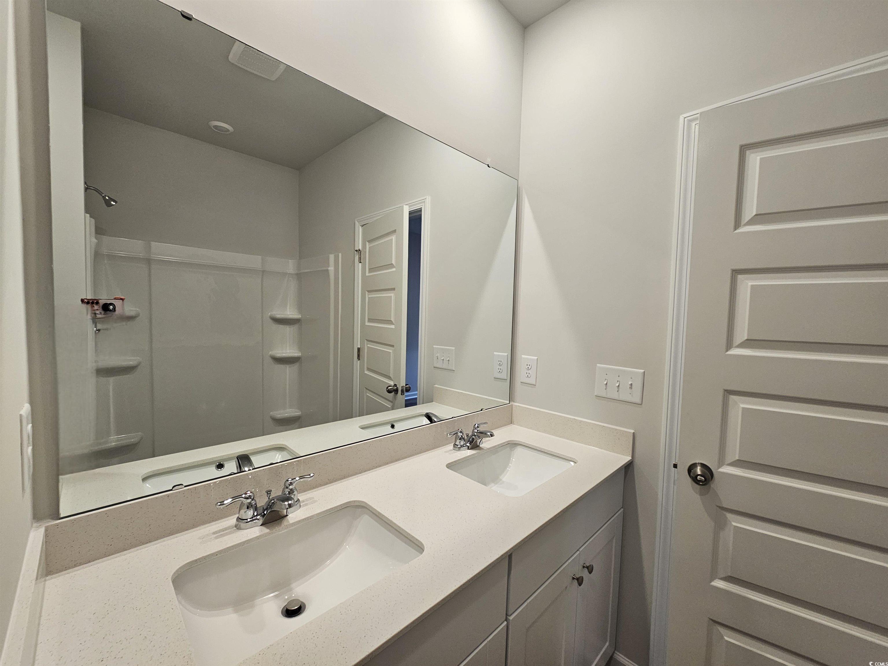 2096 Wild Indigo Circle Calabash, NC 28467 - Photo 14 of 29 Full bathroom with double vanity