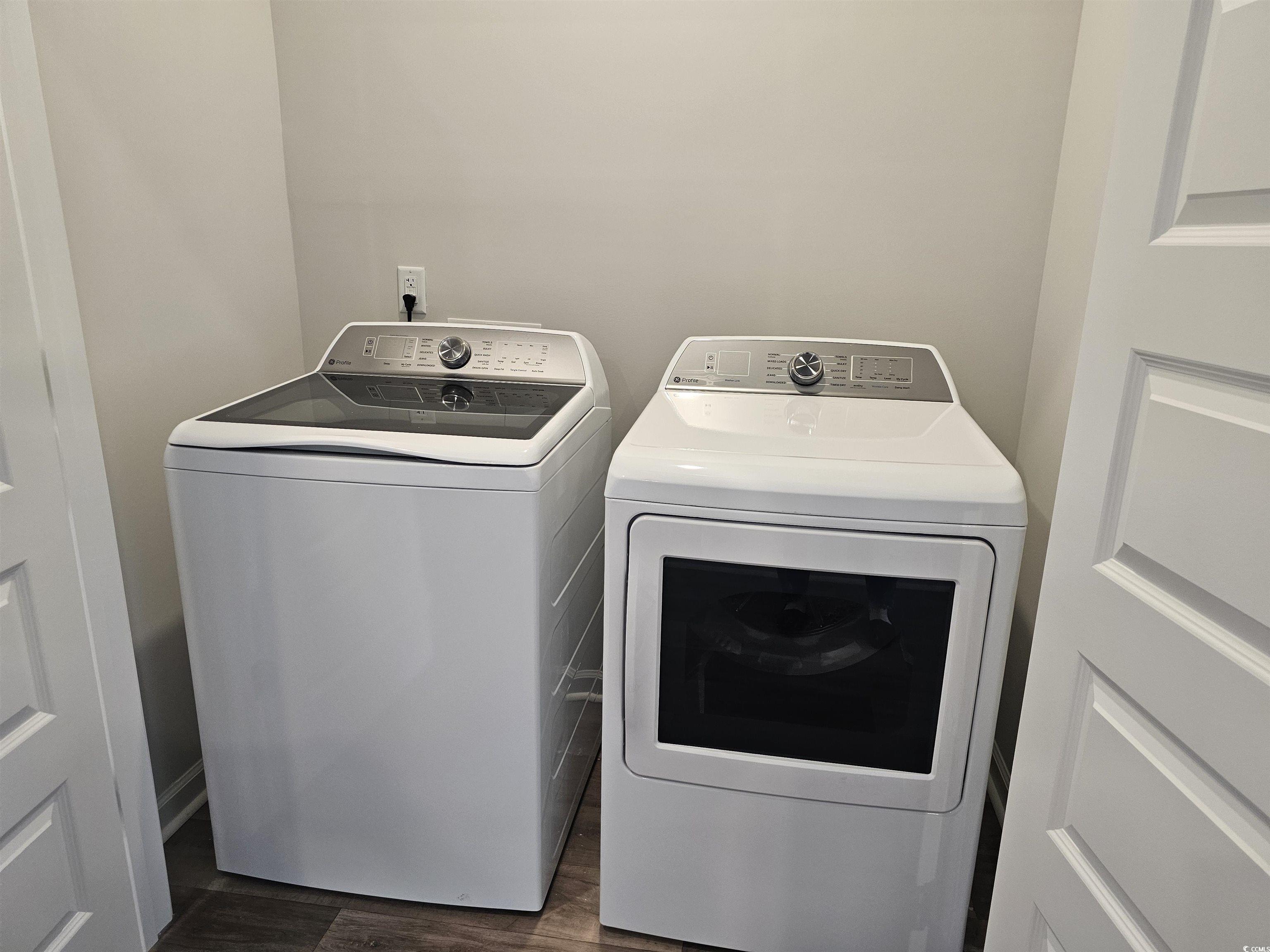 2096 Wild Indigo Circle Calabash, NC 28467 - Photo 25 of 29 Washroom featuring washing machine and clothes dryer and dark wood-style flooring