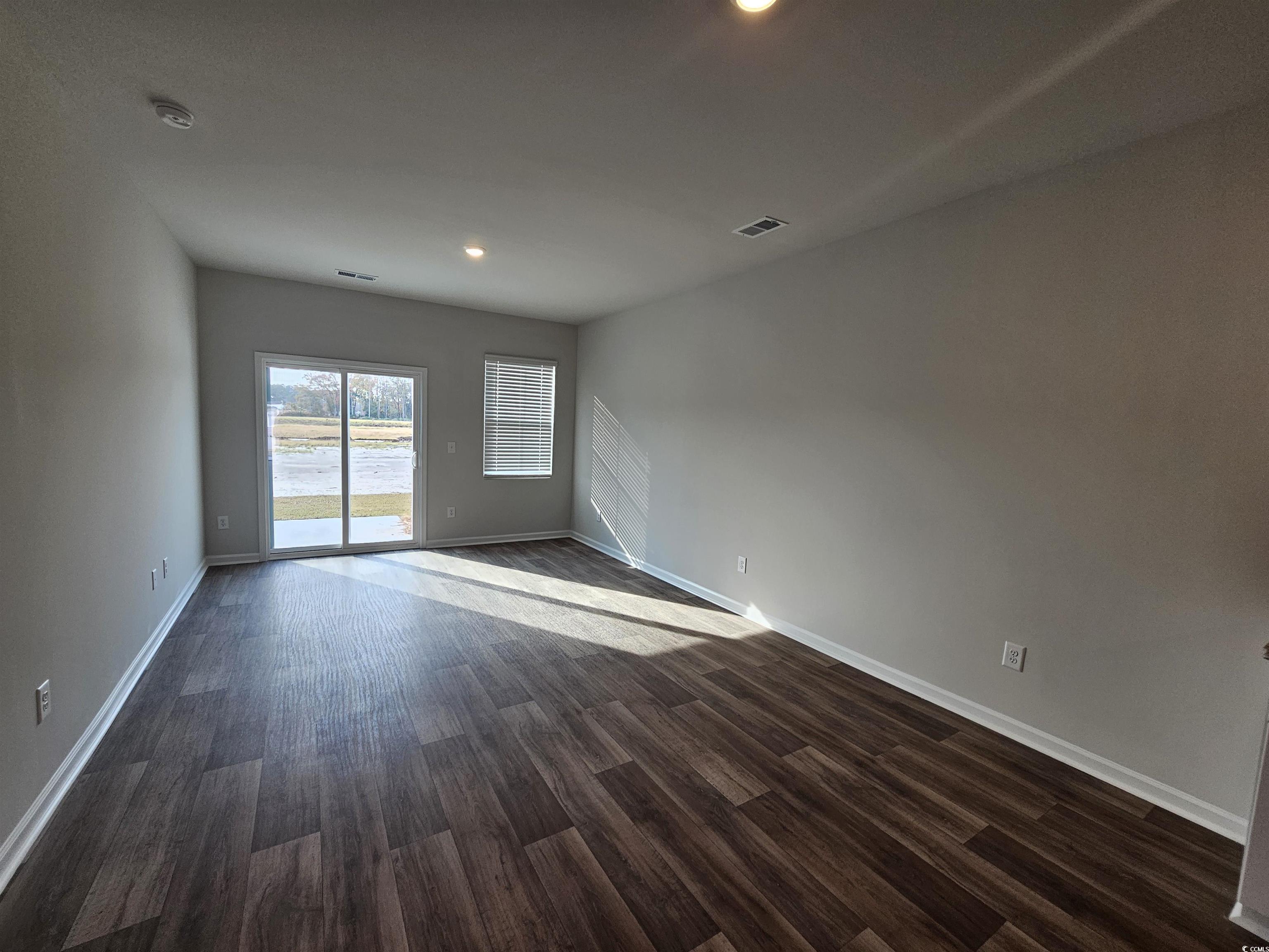 2096 Wild Indigo Circle Calabash, NC 28467 - Photo 9 of 29 Unfurnished room featuring dark wood-style floors and recessed lighting