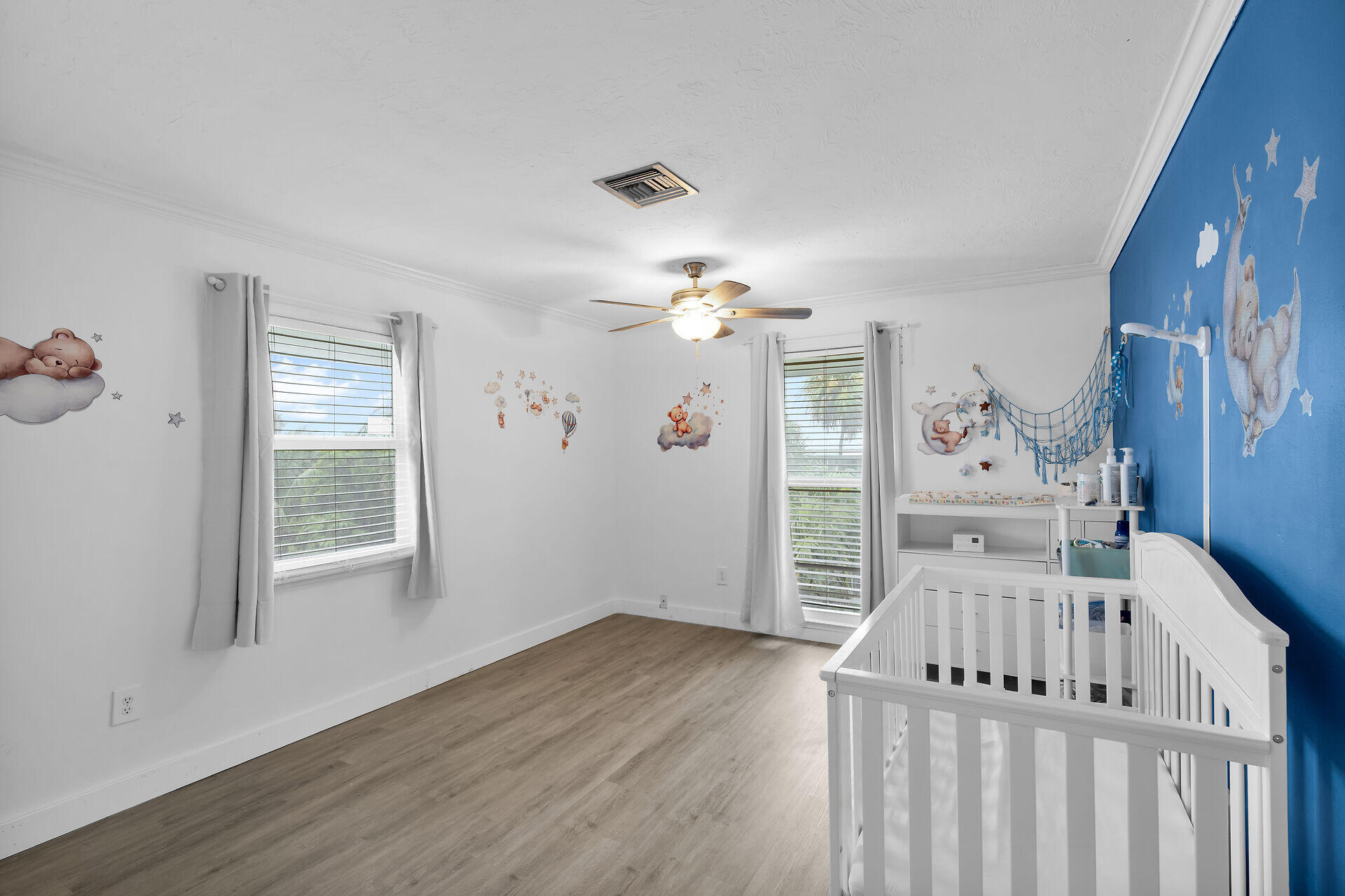 111 Stirrup Key Woods Road, Unit 2B1 Marathon, FL 33050 - Photo 24 of 36 a view of a livingroom with wooden floor windows and a kitchen view