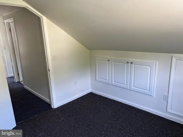 an empty room with wooden floor