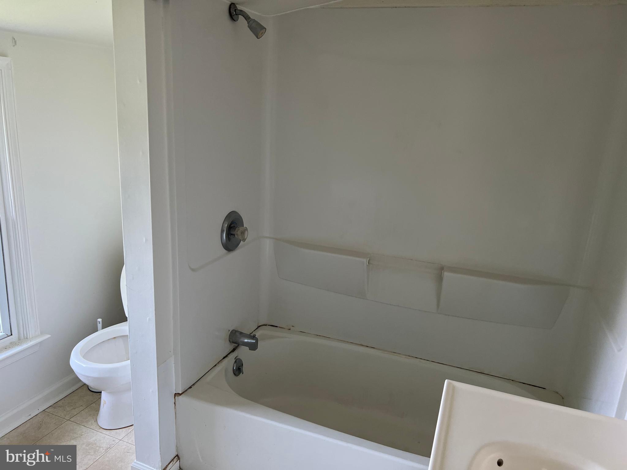 1636 Otts Chapel Road Newark, DE 19702 - Photo 17 of 24 a white bath tub sitting next to a toilet