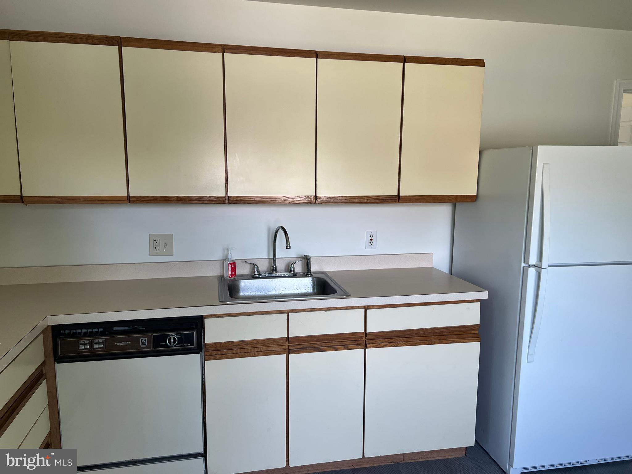 1636 Otts Chapel Road Newark, DE 19702 - Photo 20 of 24 a kitchen with stainless steel appliances a sink a stove and a refrigerator with wooden floor