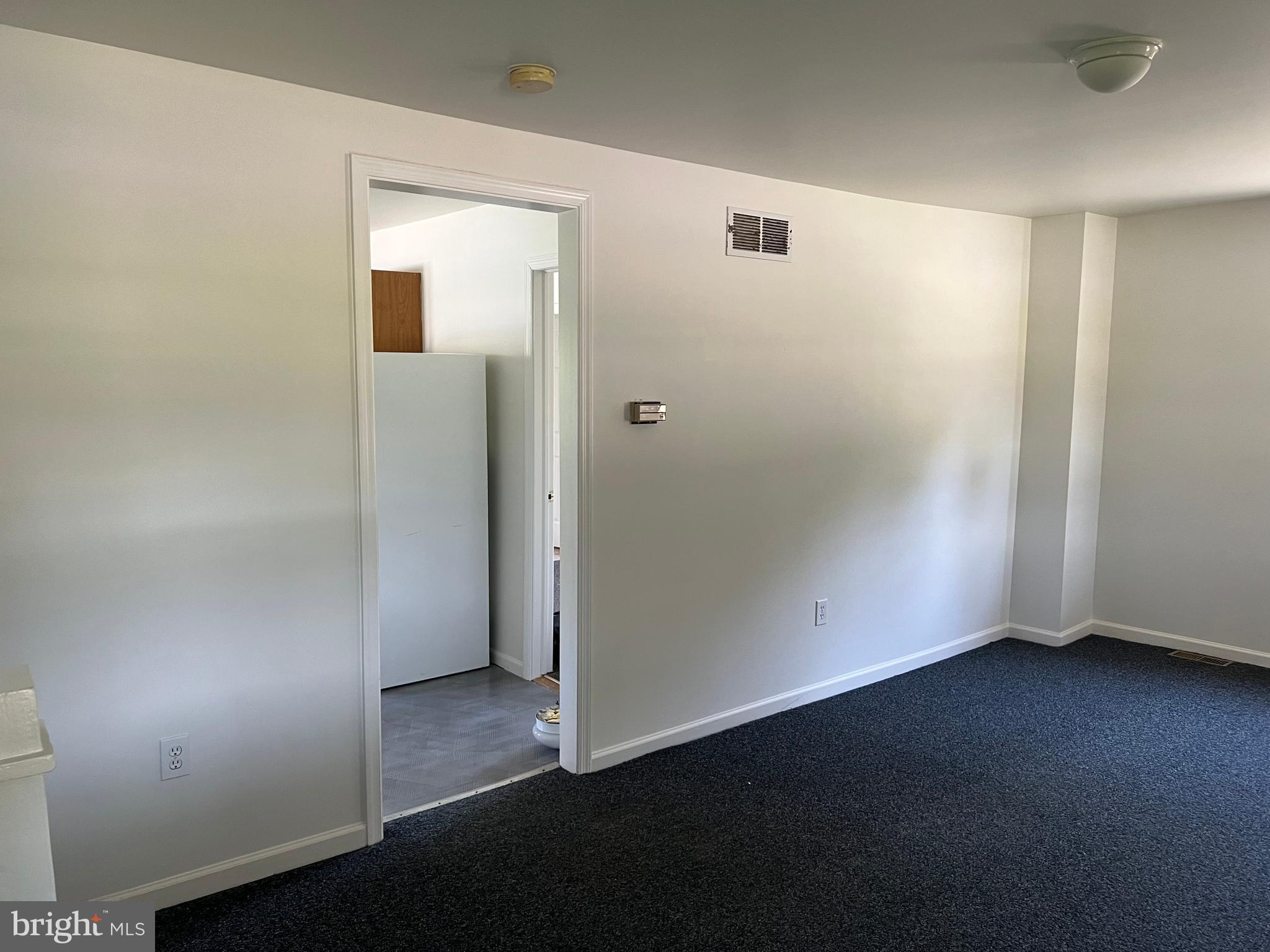 1636 Otts Chapel Road Newark, DE 19702 - Photo 5 of 24 an empty room with wooden floor and windows