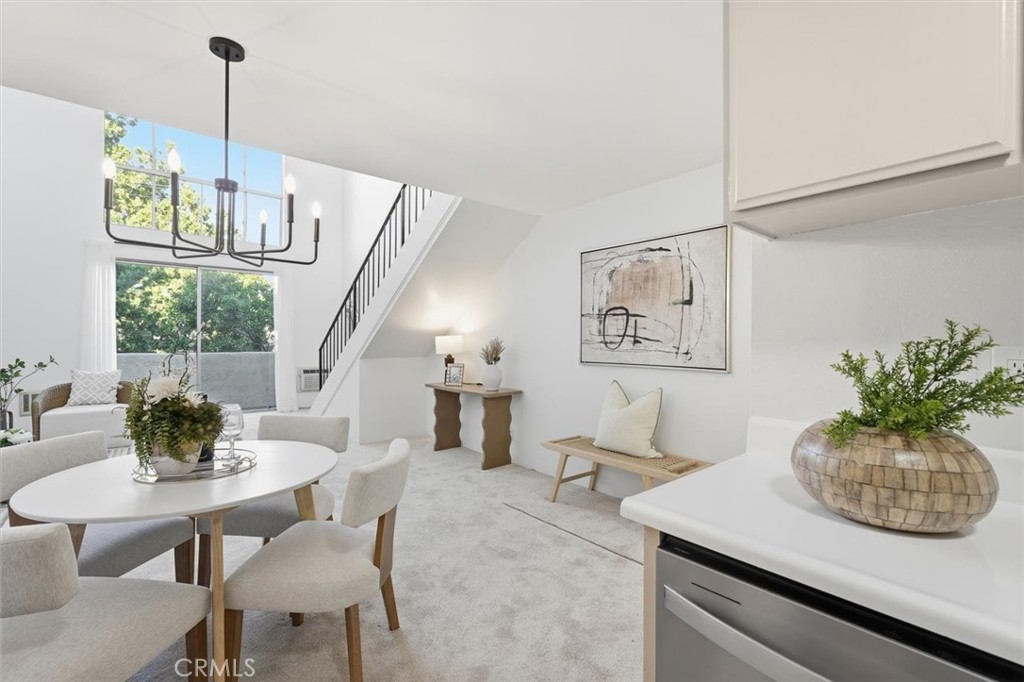 11645 Montana Avenue, Unit 321 Los Angeles, CA 90049 - Photo 17 of 41 a view of a dining room with furniture window and wooden floor