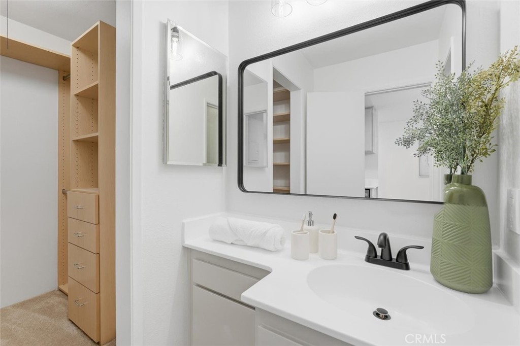11645 Montana Avenue, Unit 321 Los Angeles, CA 90049 - Photo 10 of 41 a bathroom with a sink and a mirror
