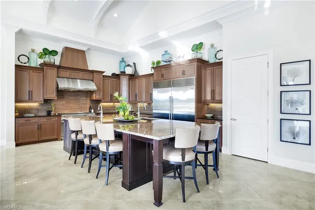 a kitchen with a table and chairs in it