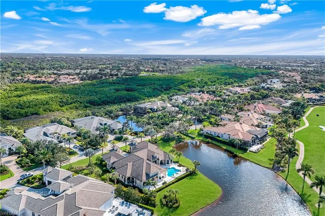 a view of a lake with a house in the background