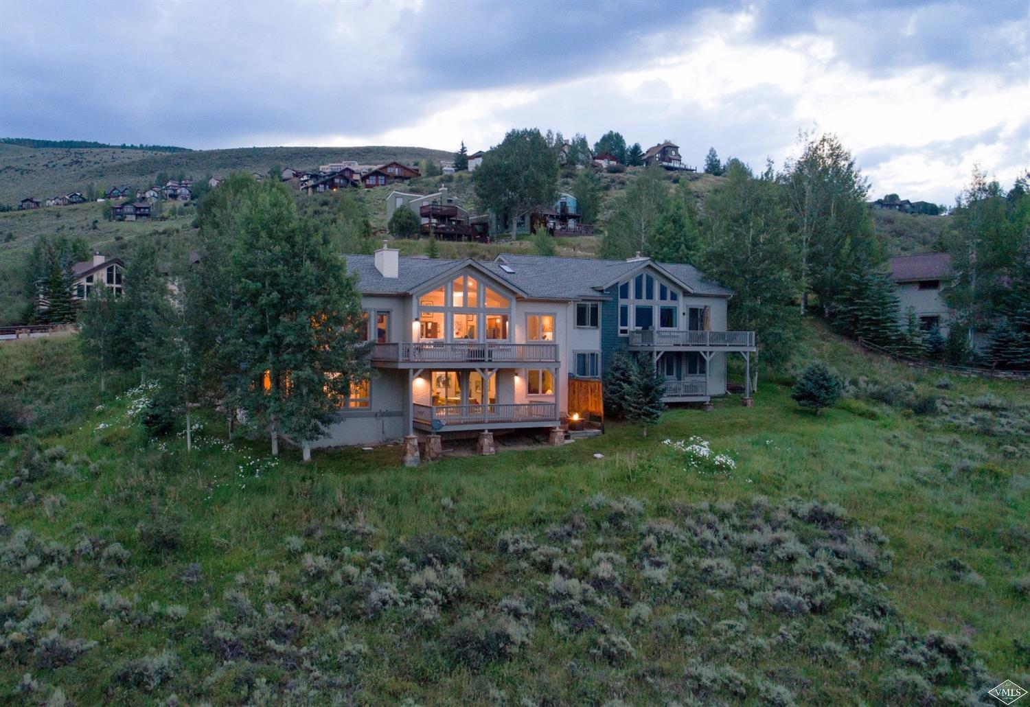 5015 Wildridge Road East, Unit A Avon, CO 81620 - Photo 1 of 22 an aerial view of a house with roof deck and garden