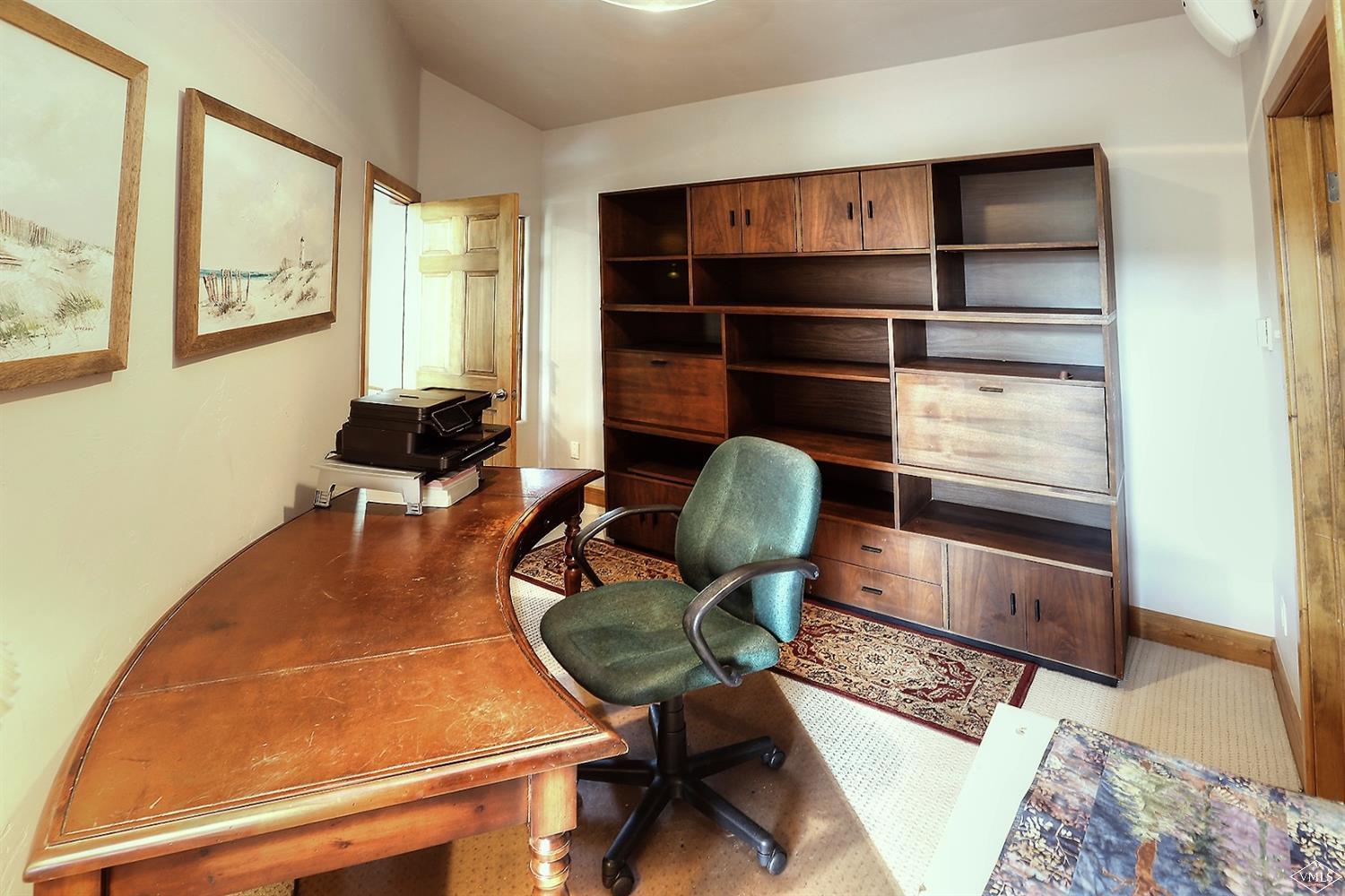 5015 Wildridge Road East, Unit A Avon, CO 81620 - Photo 11 of 22 a room with furniture cabinets and wooden floor