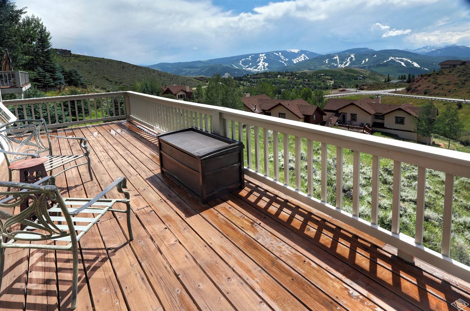 5015 Wildridge Road East, Unit A Avon, CO 81620 - Photo 2 of 22 a view of a balcony with wooden floor and outdoor seating