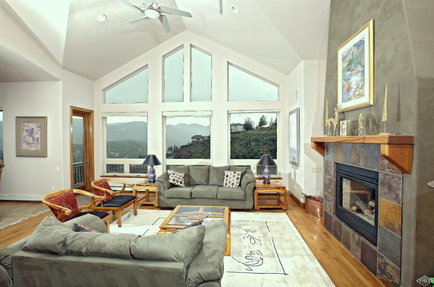 5015 Wildridge Road East, Unit A Avon, CO 81620 - Photo 5 of 22 a living room with furniture and a fireplace