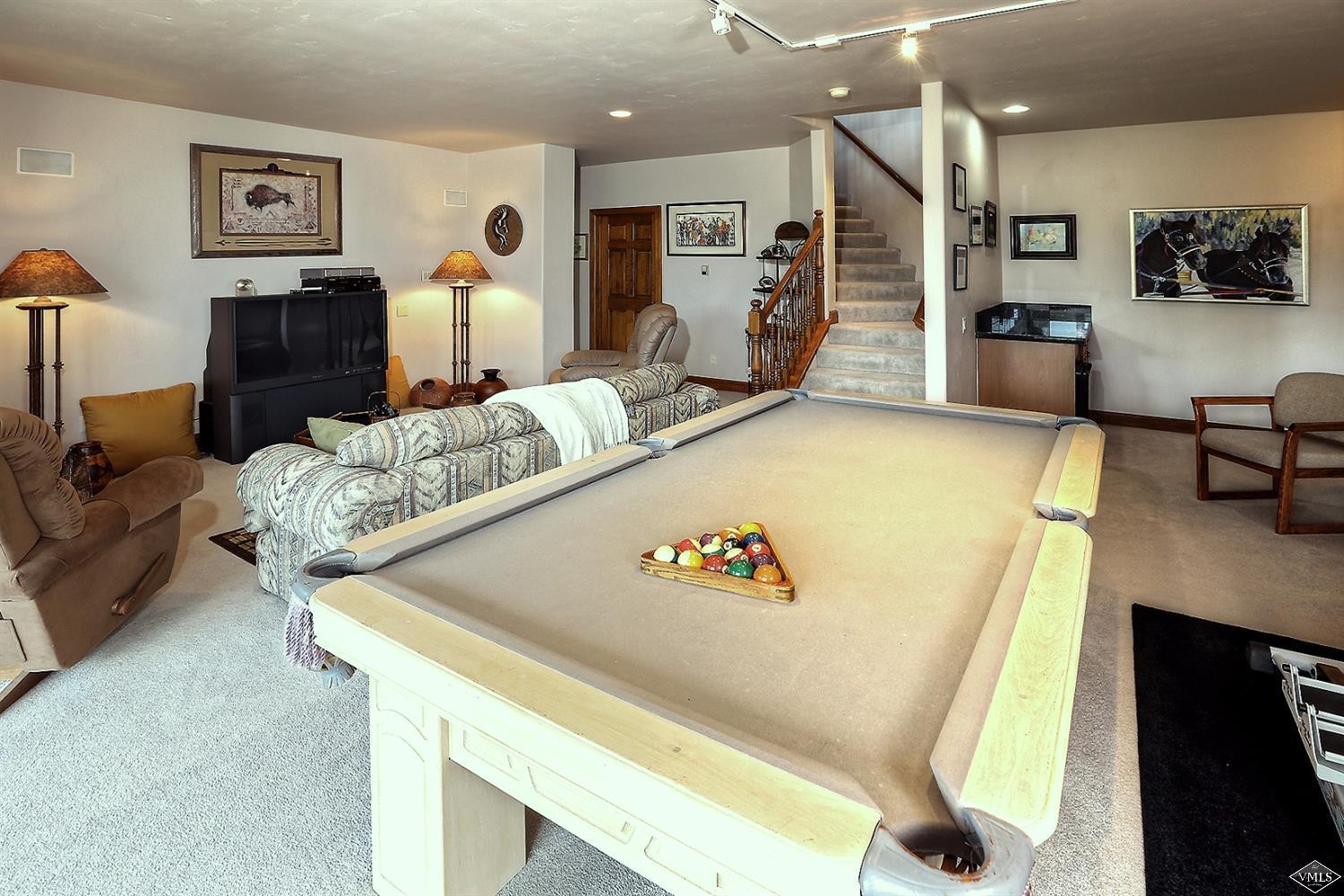 5015 Wildridge Road East, Unit A Avon, CO 81620 - Photo 9 of 22 a living room with furniture and a table