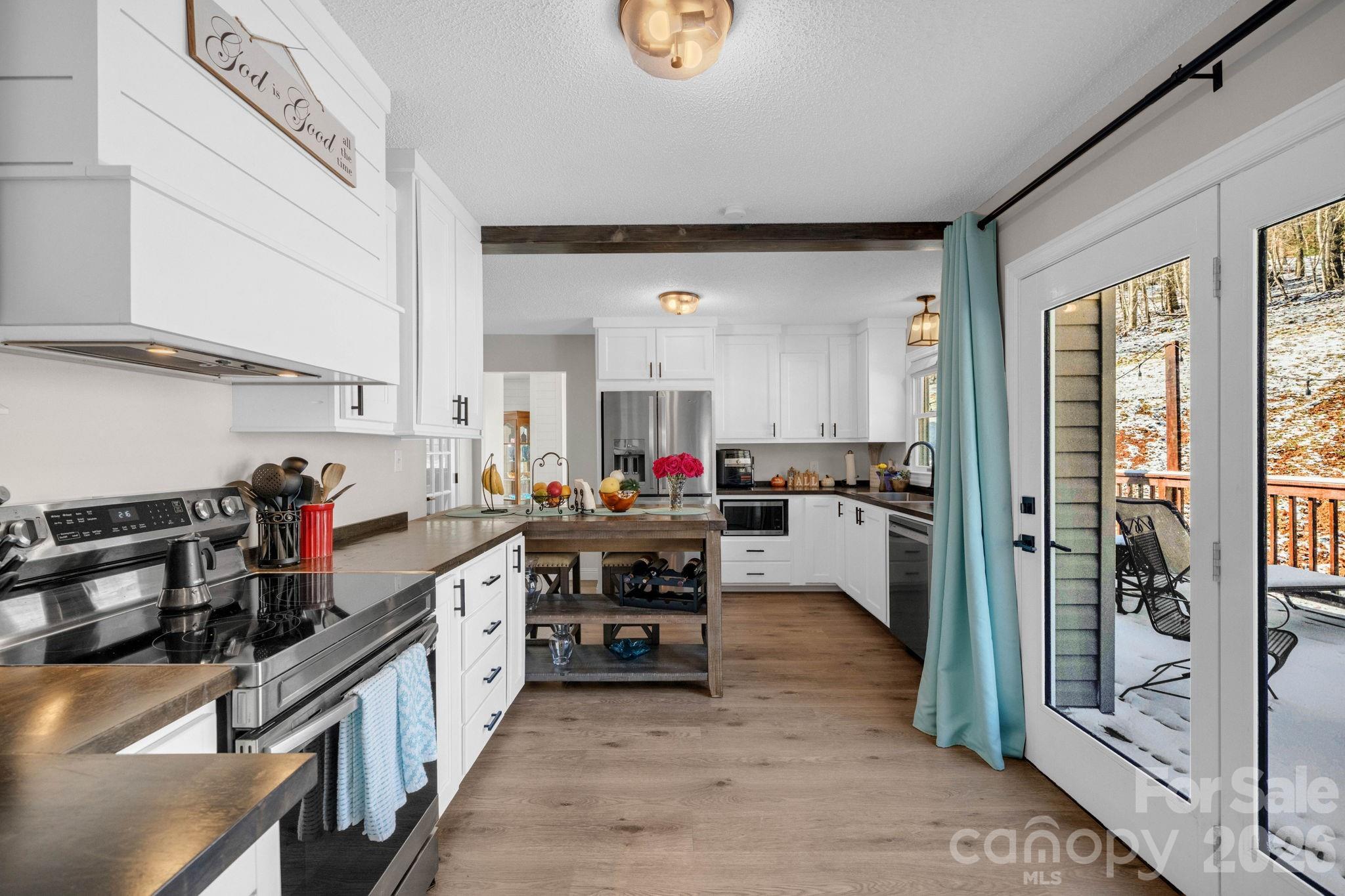2581 Double Island Road Green Mountain, NC 28740 - Photo 11 of 48 a kitchen with lots of counter top space and stainless steel appliances