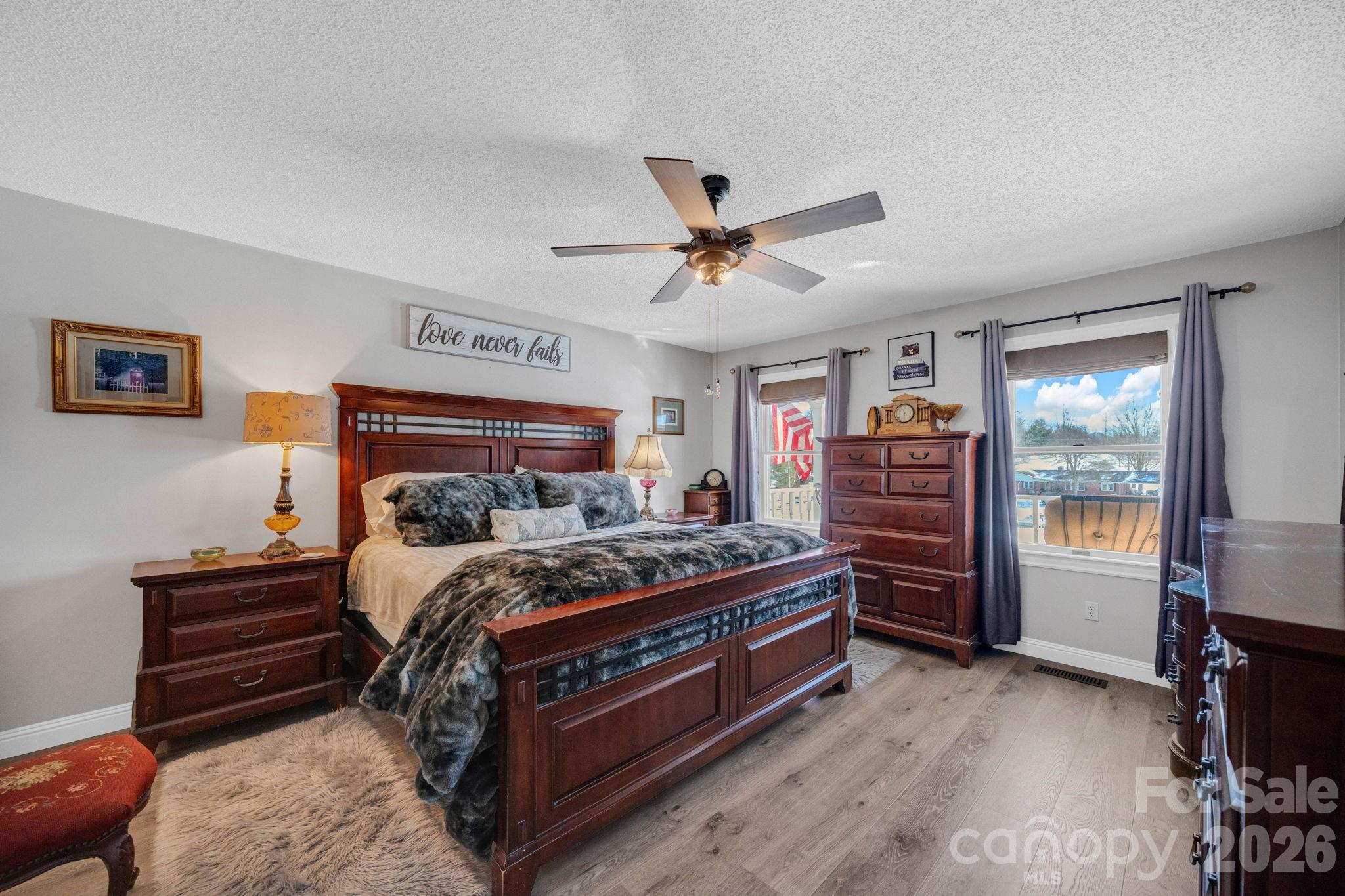 2581 Double Island Road Green Mountain, NC 28740 - Photo 17 of 48 a bed room with a bed and a chandelier