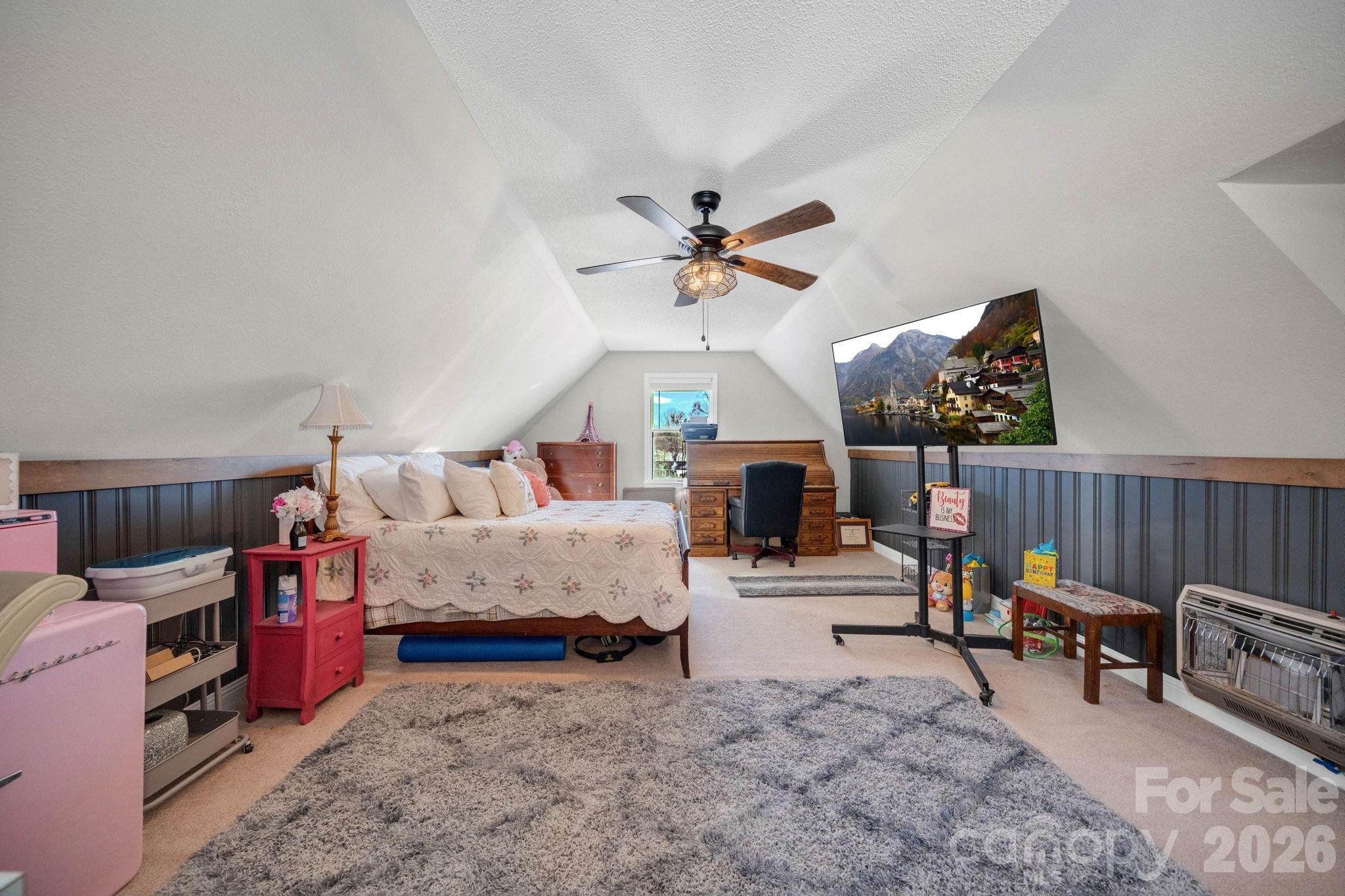 2581 Double Island Road Green Mountain, NC 28740 - Photo 29 of 48 a bedroom with furniture and a chandelier