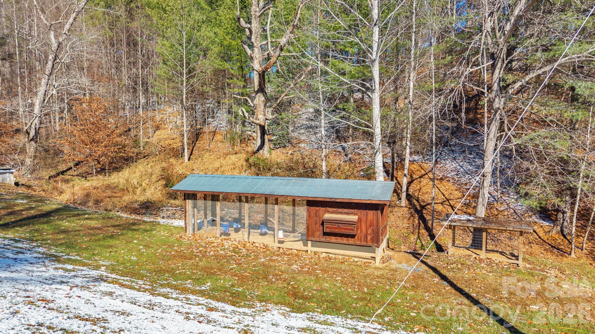 2581 Double Island Road Green Mountain, NC 28740 - Photo 35 of 48 a front view of a house with a yard
