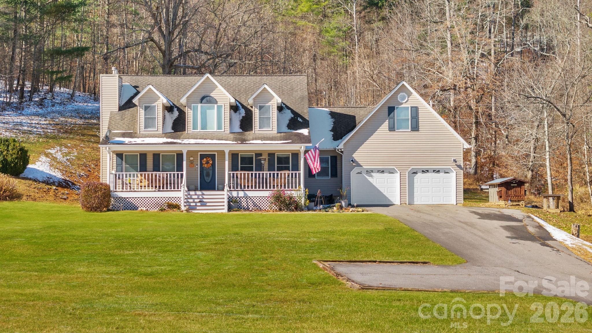 2581 Double Island Road Green Mountain, NC 28740 - Photo 4 of 48 a view of a house with a yard
