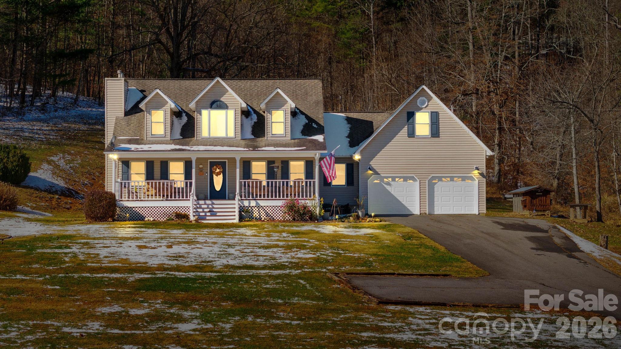 2581 Double Island Road Green Mountain, NC 28740 - Photo 5 of 48 a front view of a house with a yard