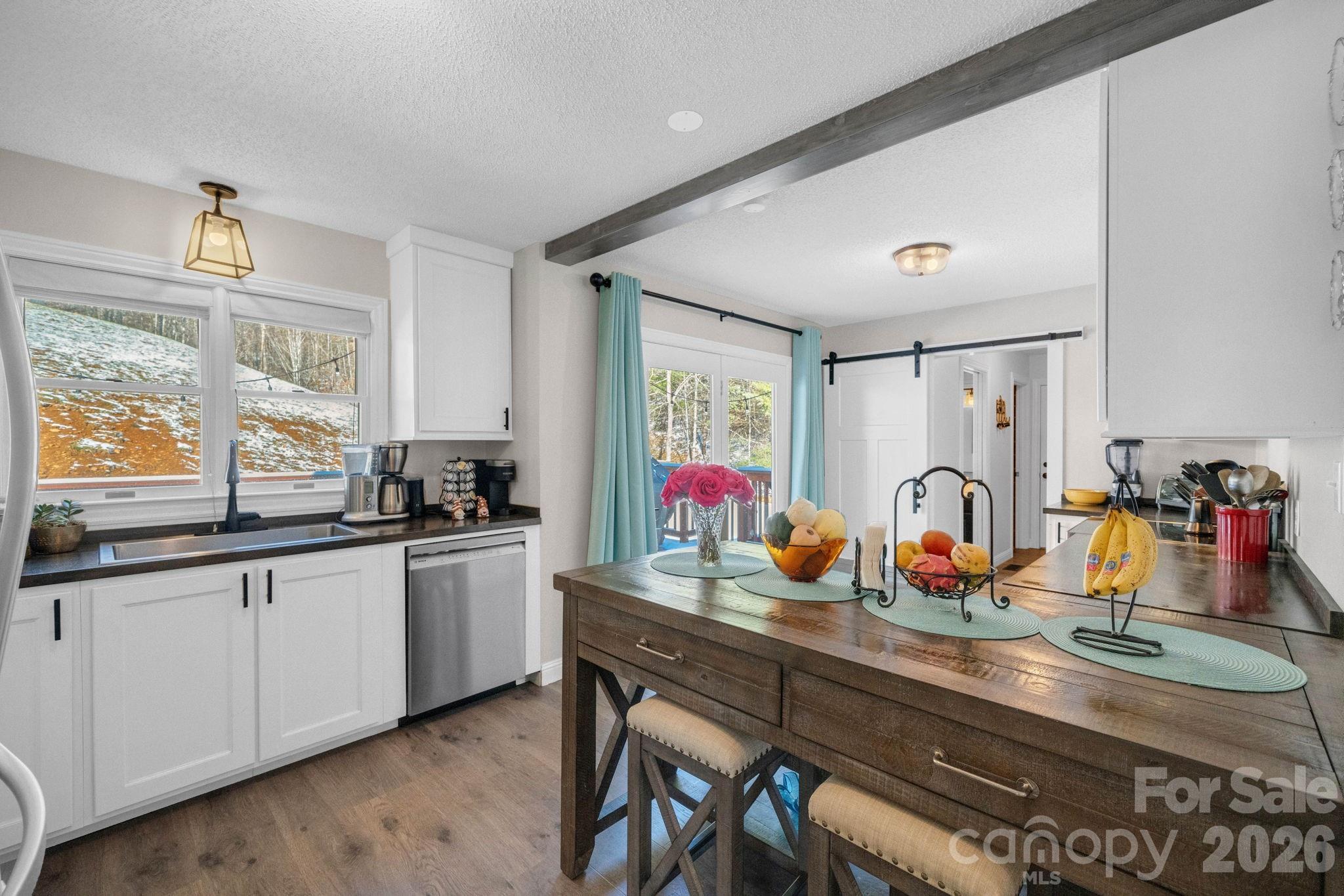 2581 Double Island Road Green Mountain, NC 28740 - Photo 10 of 48 a kitchen with lots of counter top space and windows