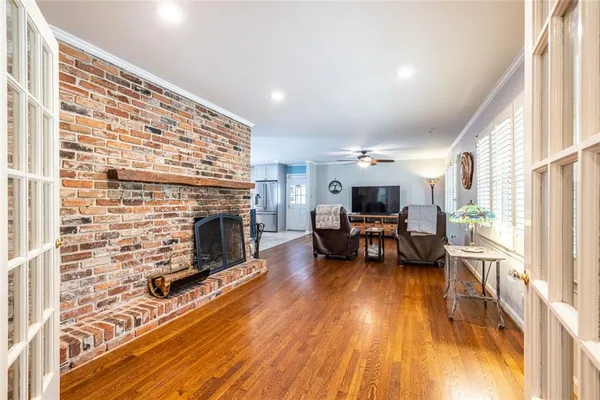 a living room with furniture and a fireplace