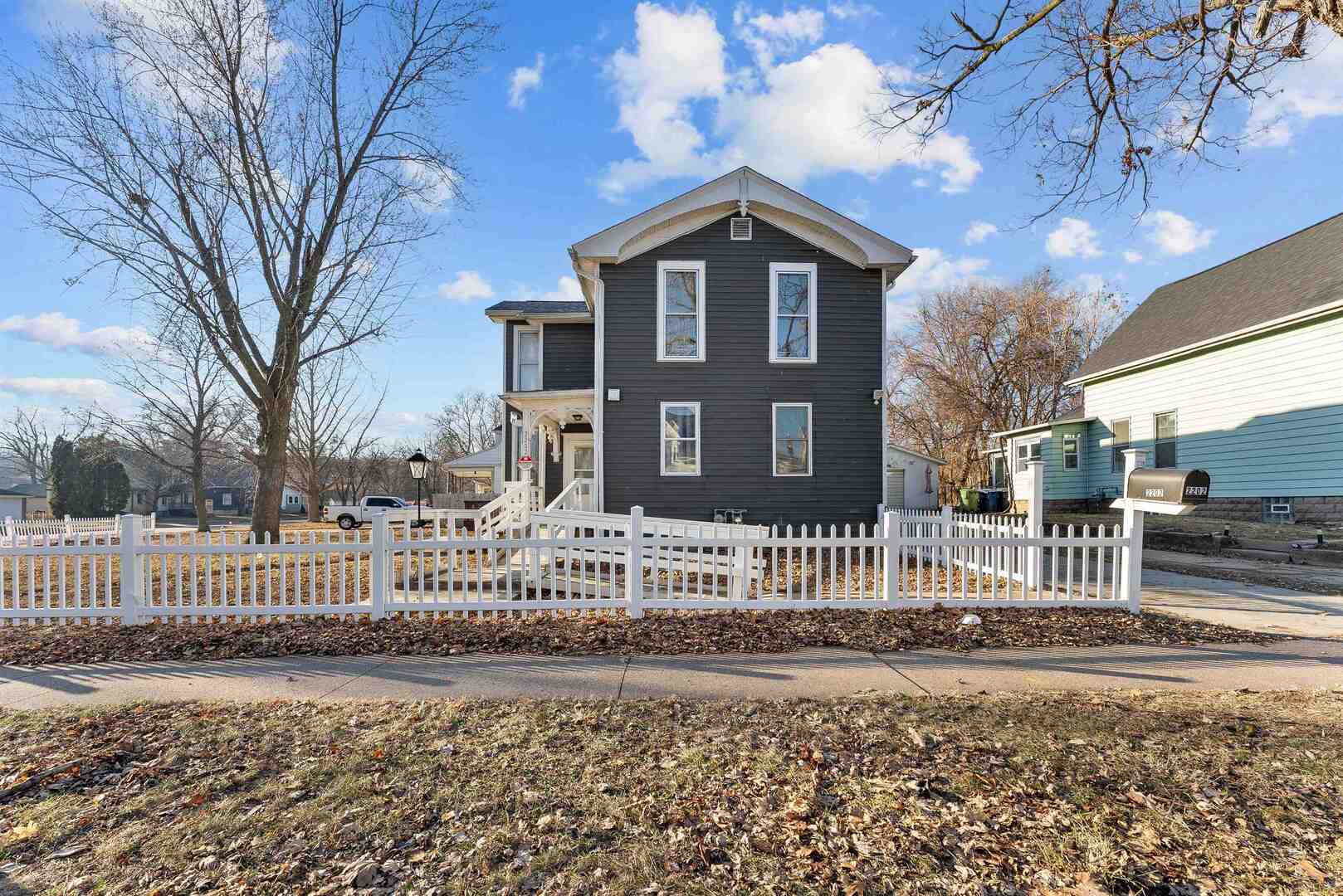 2202 Pershing Boulevard Clinton, IA 52732 - Photo 1 of 32 a front view of a house with a garden