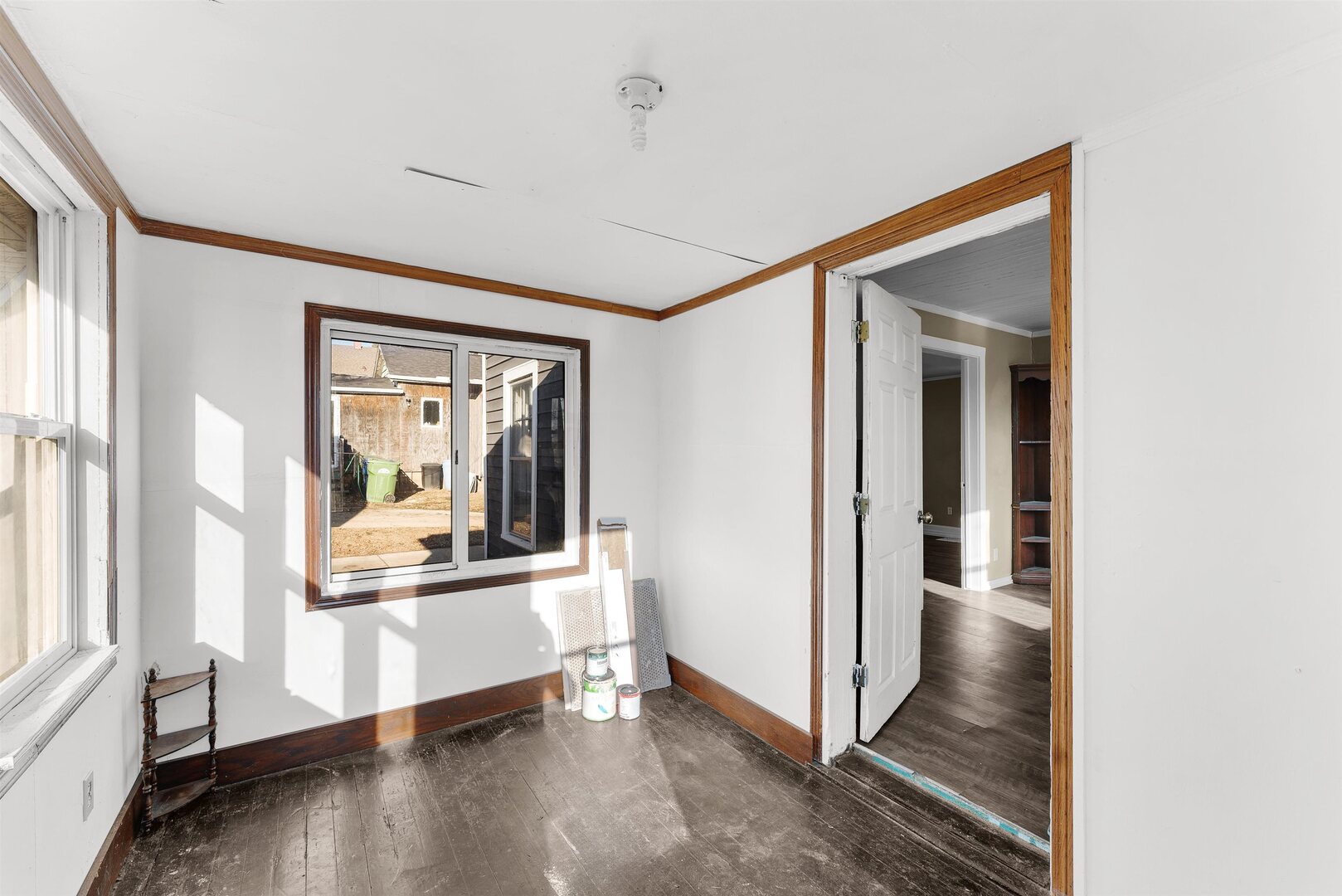 2202 Pershing Boulevard Clinton, IA 52732 - Photo 14 of 32 a view of a hallway with wooden floor and a kitchen
