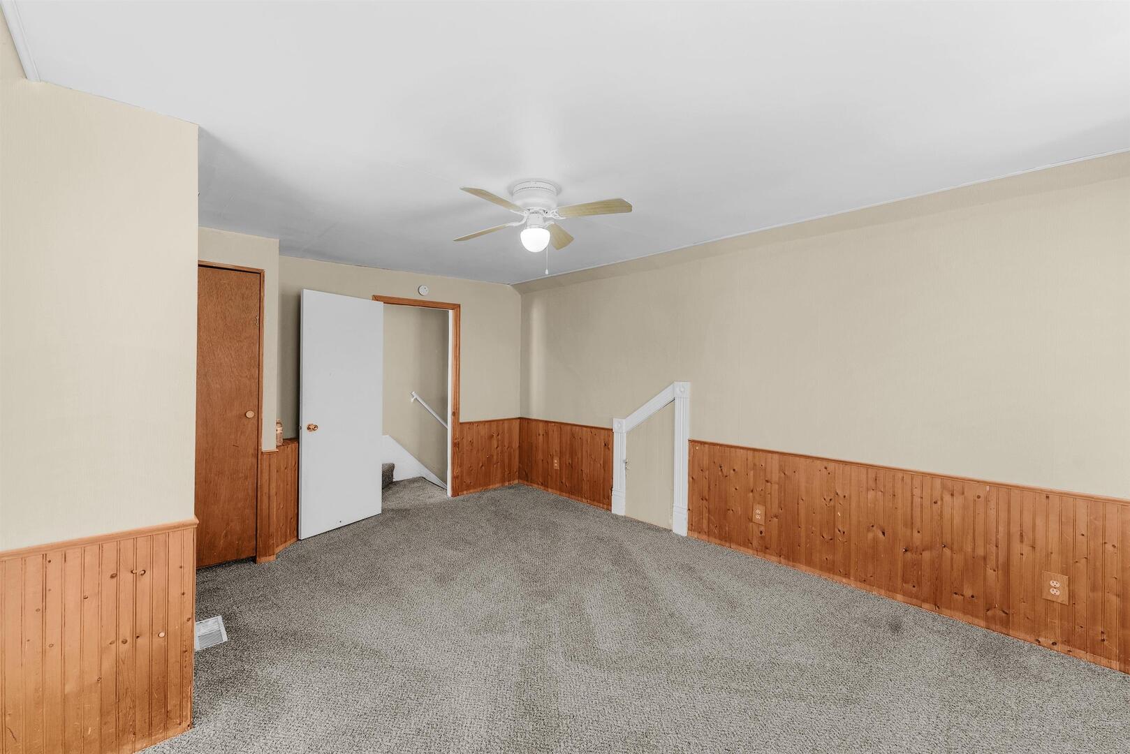 2202 Pershing Boulevard Clinton, IA 52732 - Photo 17 of 32 an empty room with closet and fan