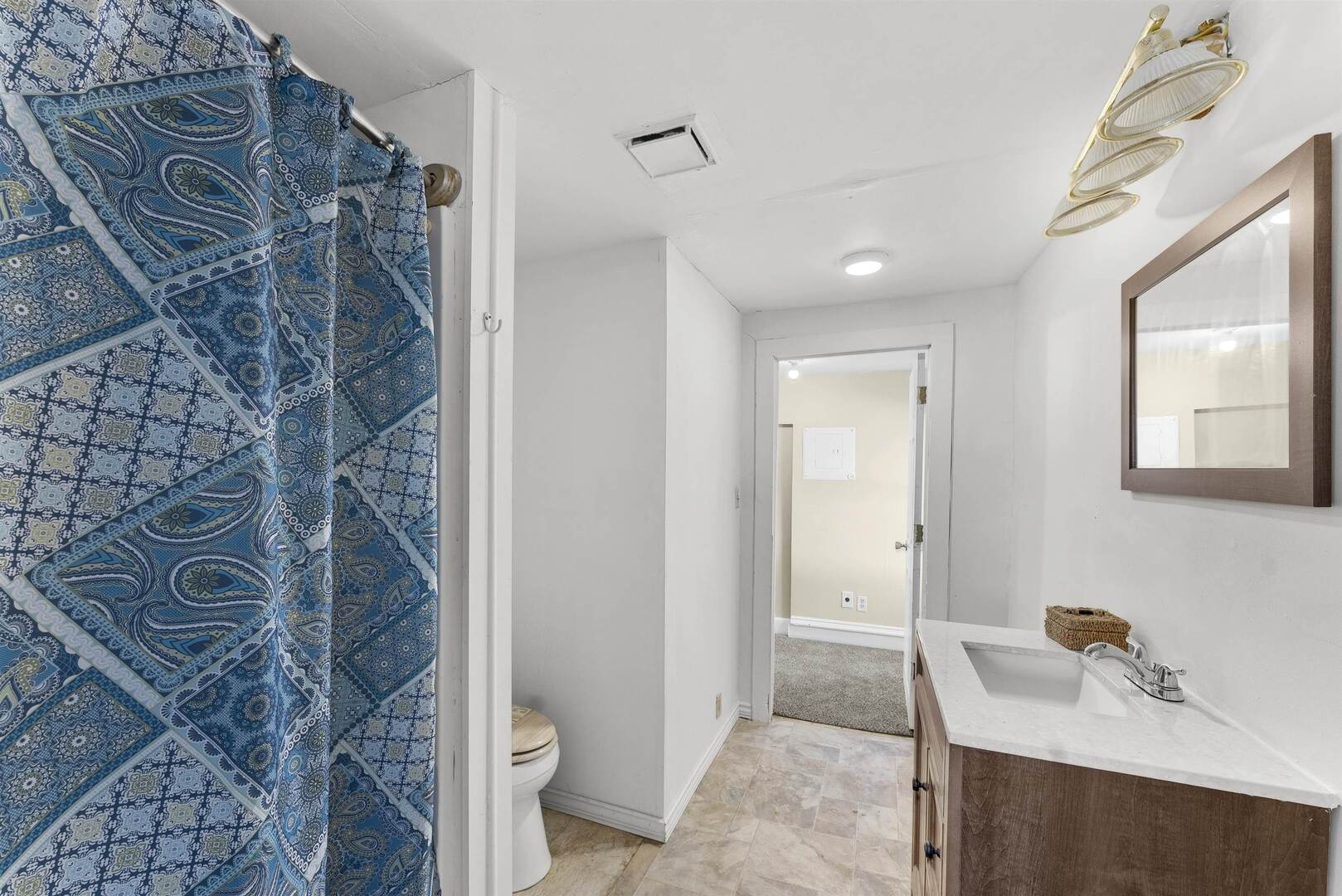 2202 Pershing Boulevard Clinton, IA 52732 - Photo 19 of 32 a bathroom with a sink and a toilet