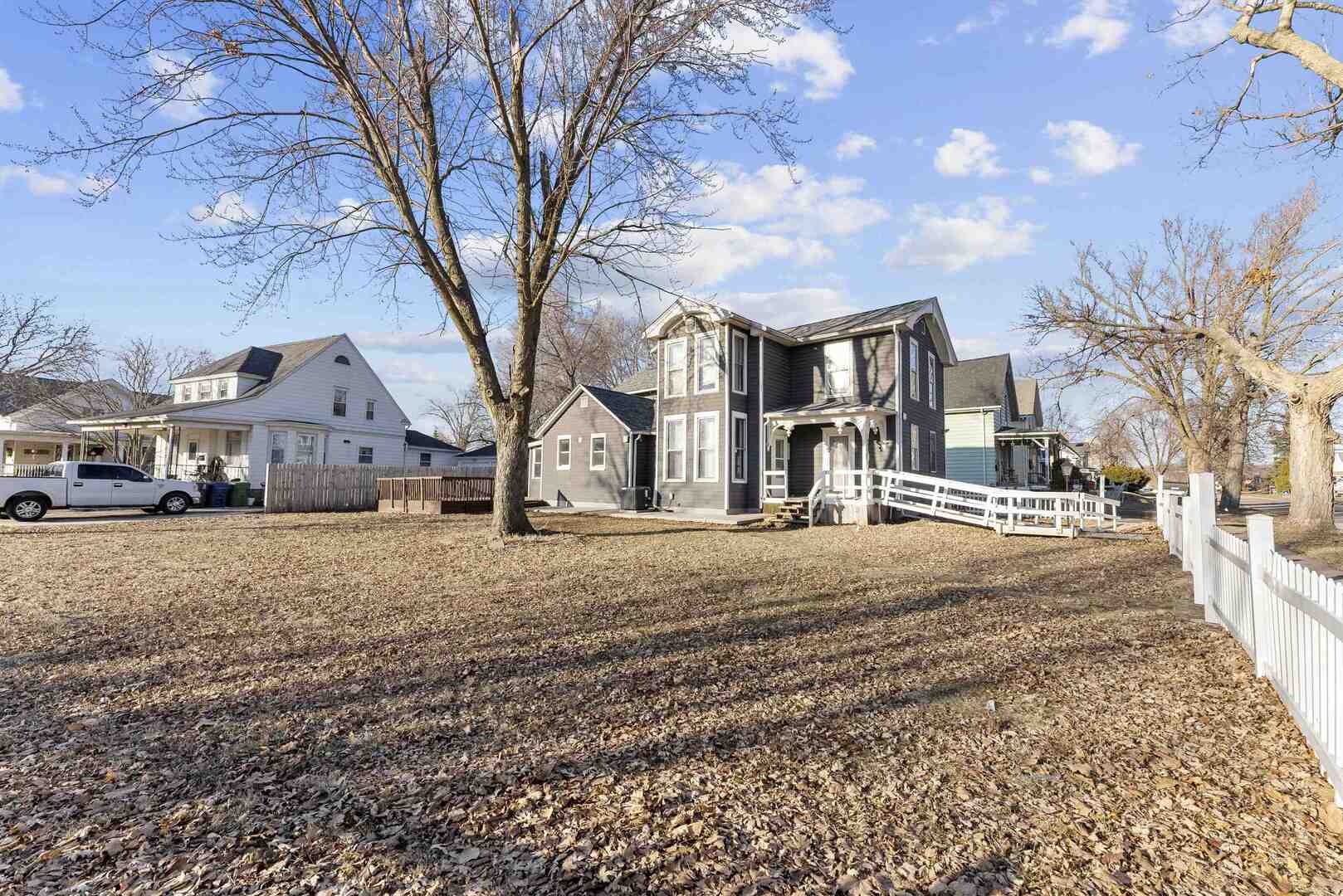 2202 Pershing Boulevard Clinton, IA 52732 - Photo 29 of 32 a house with a tree in front of it