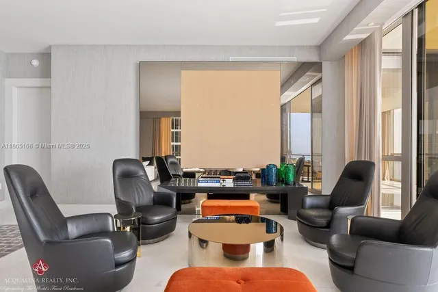 a living room with furniture and a rug