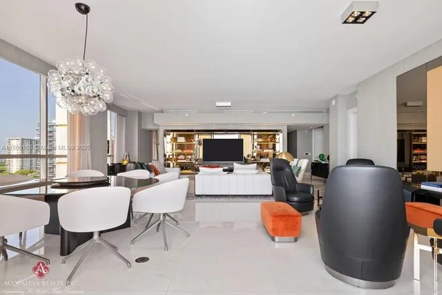 a kitchen with stainless steel appliances granite countertop a sink stove oven and white cabinets