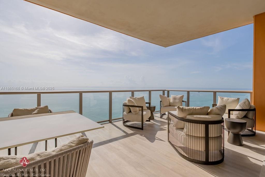 17749 Collins Avenue, Unit 902 Sunny Isles Beach, FL 33160 - Photo 20 of 82 a living room with furniture and a window