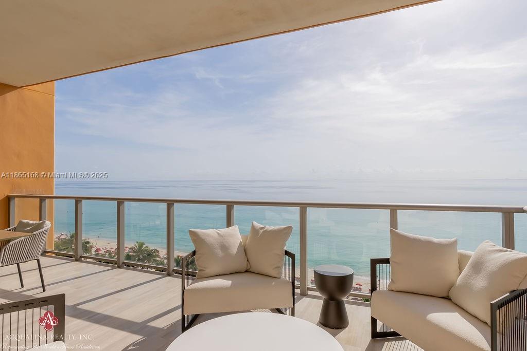 17749 Collins Avenue, Unit 902 Sunny Isles Beach, FL 33160 - Photo 21 of 82 a balcony with furniture and city view