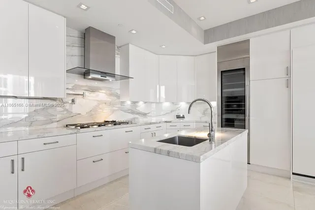 a bedroom with a bed and large windows