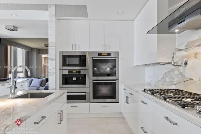 a bedroom with a large bed and a large window