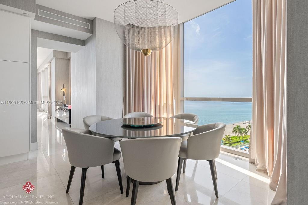 17749 Collins Avenue, Unit 902 Sunny Isles Beach, FL 33160 - Photo 33 of 82 a view of a dining room with furniture window and outside view