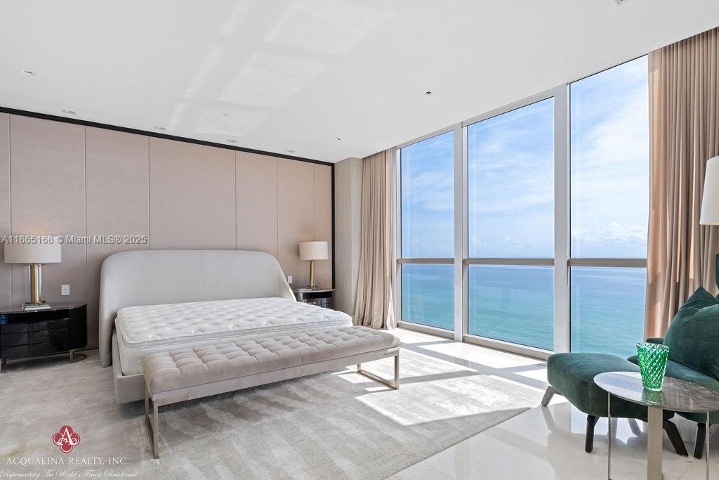 17749 Collins Avenue, Unit 902 Sunny Isles Beach, FL 33160 - Photo 38 of 82 a bedroom with a bed and a table