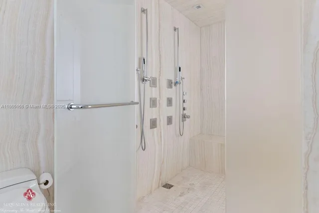 a bedroom with a bed and a view of balcony