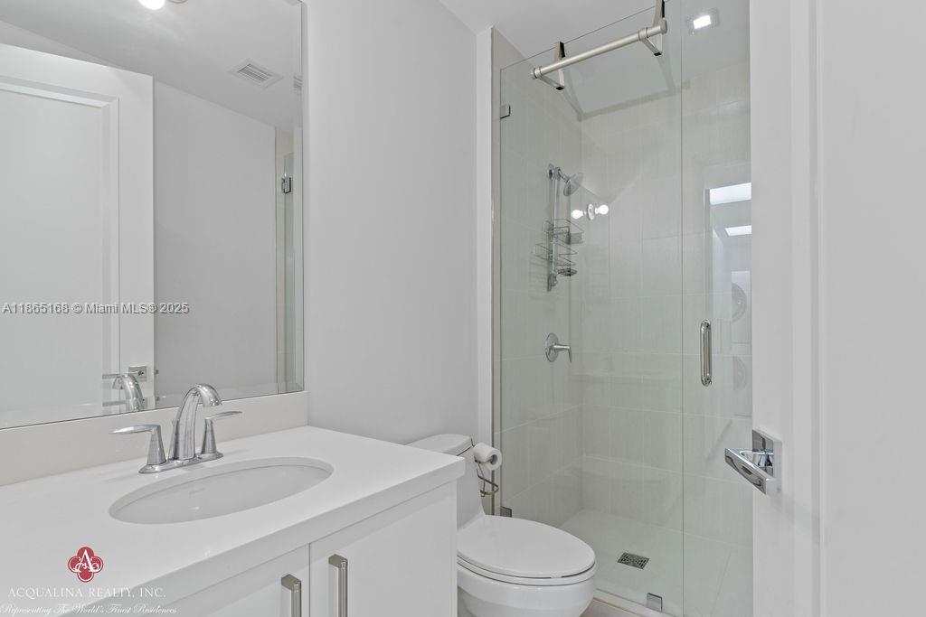17749 Collins Avenue, Unit 902 Sunny Isles Beach, FL 33160 - Photo 63 of 82 a bathroom with a sink toilet and shower